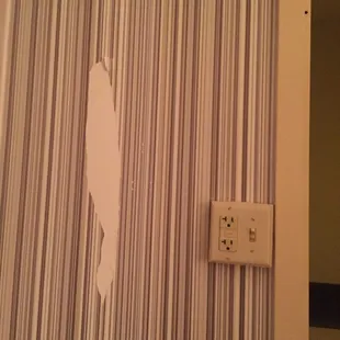 Large strip of wallpaper missing when I got to my room.