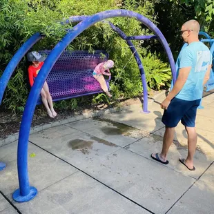 Swings in a shaded section of the WOW.