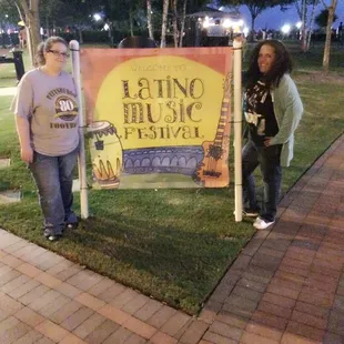 My friend and I in front of the sign.
