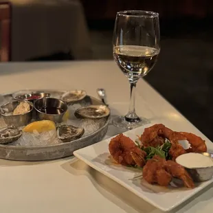 Happy hour raw oysters and buffalo shrimp