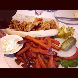 Oyster Po&apos;boy with sweet potato fries