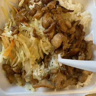 a close up of a meal in a styrofoam container