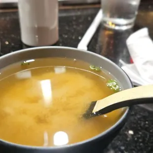 a bowl of soup with a spoon