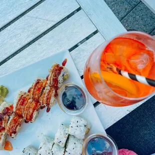 a plate of sushi and a drink