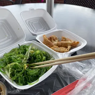 Seaweed salad and fried dumplings.