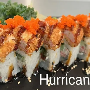 a plate of sushi rolls