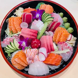 a bowl of sashimi