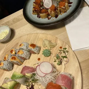 Fried Alaska roll in the background, spicy tuna roll, rainbow roll