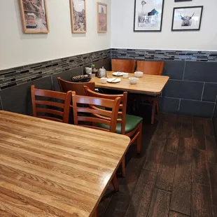 a wooden table and chairs