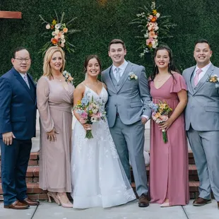 The couple and bride's family in front of the stage. We borrowed the cross from our church