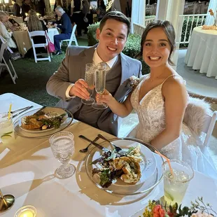 Sweetheart table in front of gazebo area.