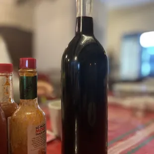 a bottle of hot sauce next to a bottle of hot sauce