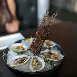 a plate of oysters on ice