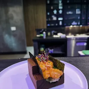 a sushi dish on a white plate