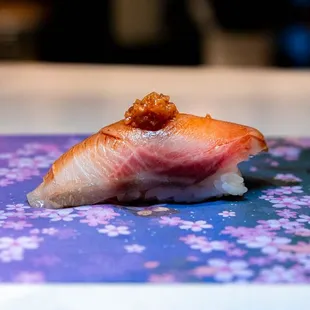 a piece of sushi on a napkin