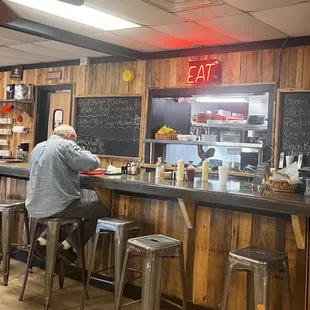 a man sitting at a counter