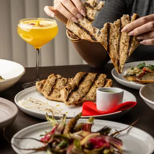 a woman eating a meal at a restaurant