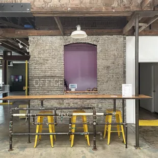 a table with four yellow stools
