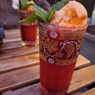 Dr. Helicopter, a black walnut infused cocktail with basil and a scoop of strawberry  ice cream on top!