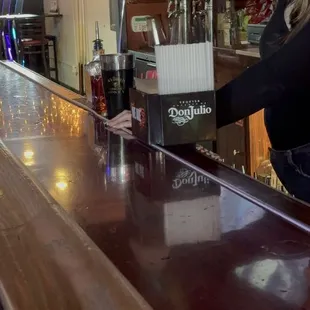 a bartender pouring a drink