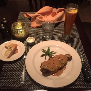 Au Pauvre New York strip with a bourbon peppercorn sauce. Medium rare. FANTASTIC!