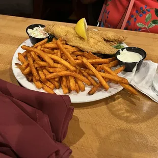 a plate of fried fish and fries