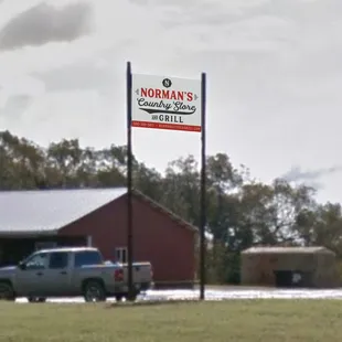 a truck parked in front of the store