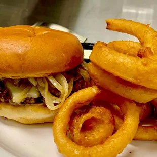 a hamburger and onion rings