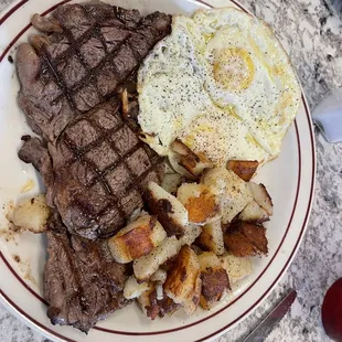 10 oz Rib Eye with house potatoes and eggs