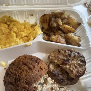 Eggs, salmon, hash potatoes, and two turkey sausages