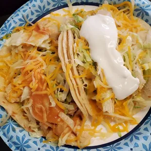 2 amazing tacos. 1 chicken 1 seasoned chicken with Dour cream
