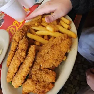 a plate of fried chicken and french fries