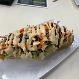 Hot dog smothered in slaw and so much mayo