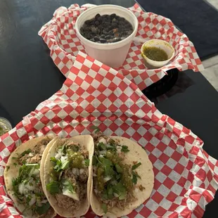 Mojo pork tacos &amp; black beans and rice!! Little cup of verde sauce!