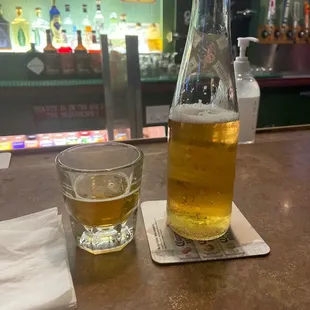 a bottle of beer and a glass