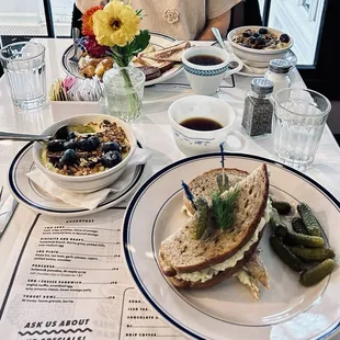 Egg salad sandwich and yogurt/granola/berry bowl.
