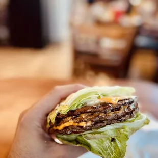 Lettuce-wrapped triple cheeseburger.