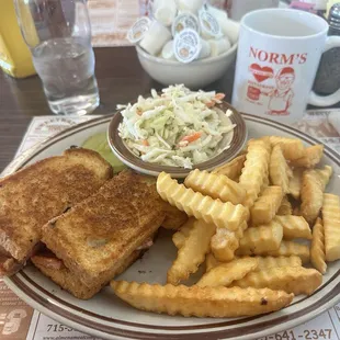 Hot ham with fries and coleslaw.