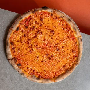 a cheese pizza on a table