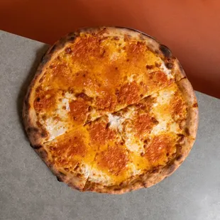 a cheese pizza on a table