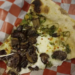 Their mushroom arugula slice