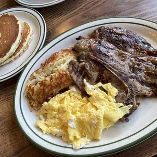 steak, eggs, pancakes and pancakes