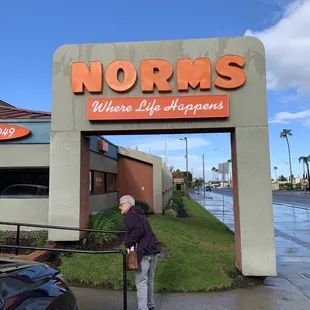 a man standing in front of the entrance