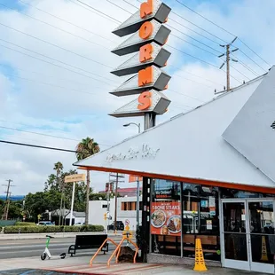 an orange and white neon sign
