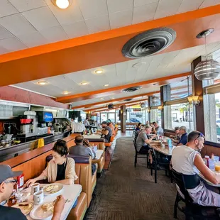 diners sitting at tables in a restaurant