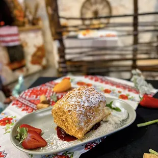 a plate of pastries and strawberries