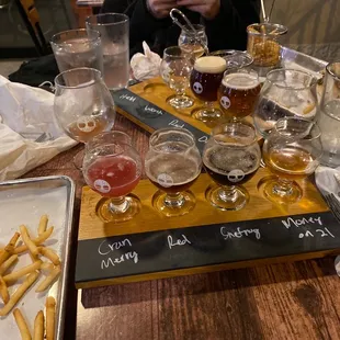 a flight of beer and fries