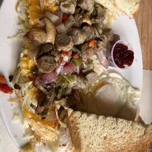 Hash brown Supreme w sour dough bread eggs sunny side up w sausage