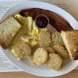 Morning sampler with white toast, potato rounds, and scrambled eggs