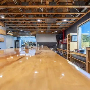 a long wooden table in the middle of the room